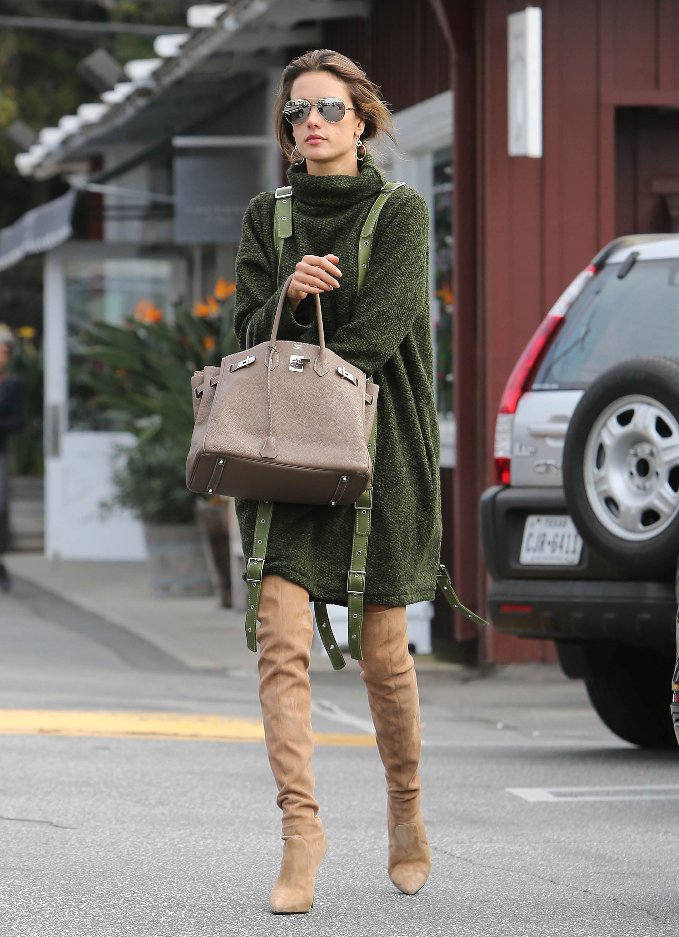 Shop Alessandra Ambrosio's turtleneck sweaterdress and over-the-knee boots look for less.