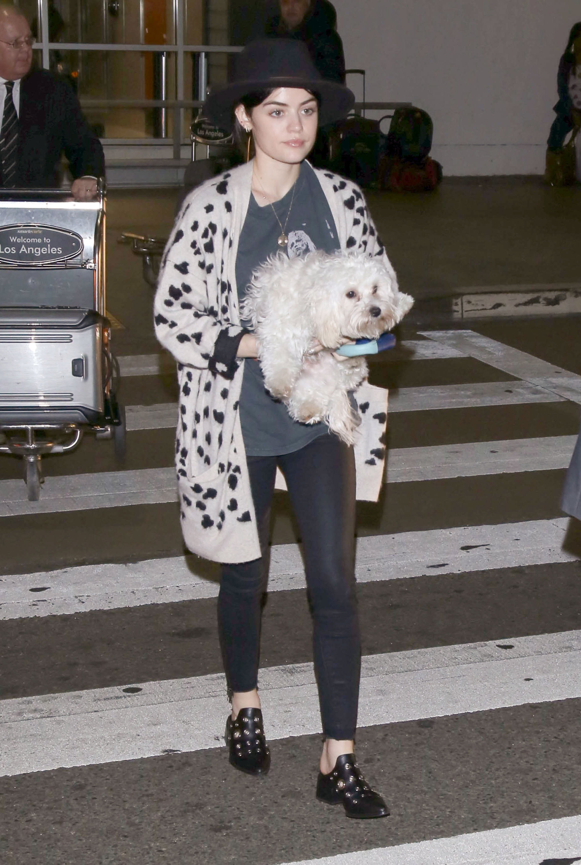 Lucy Hale gives us a chic and edgy outfit idea featuring a leopard cardigan and grommet embellished mules.