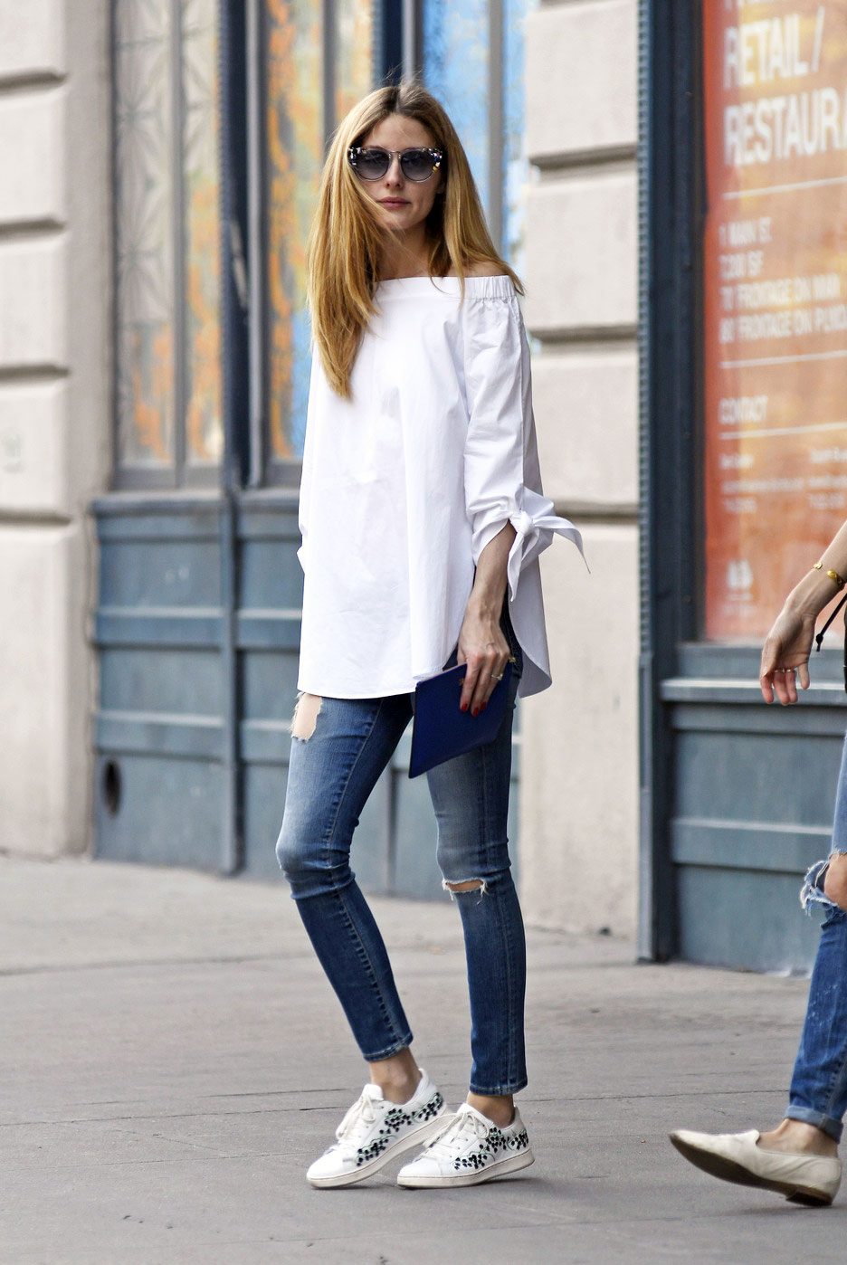 Olivia Palermo off-the-shoulder top and sneakers look for less