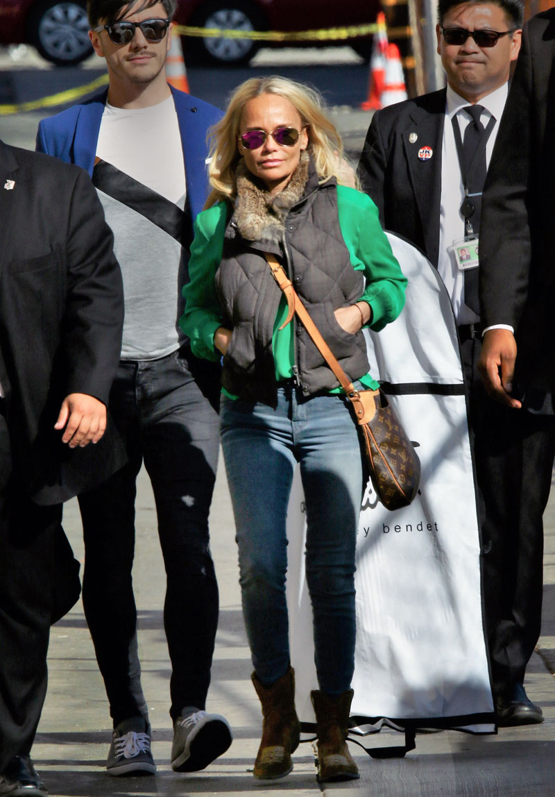 Kristin Chenoweth looks comfy and cozy in a puffer vest, emerald green blouse, skinny jeans and ankle boots.