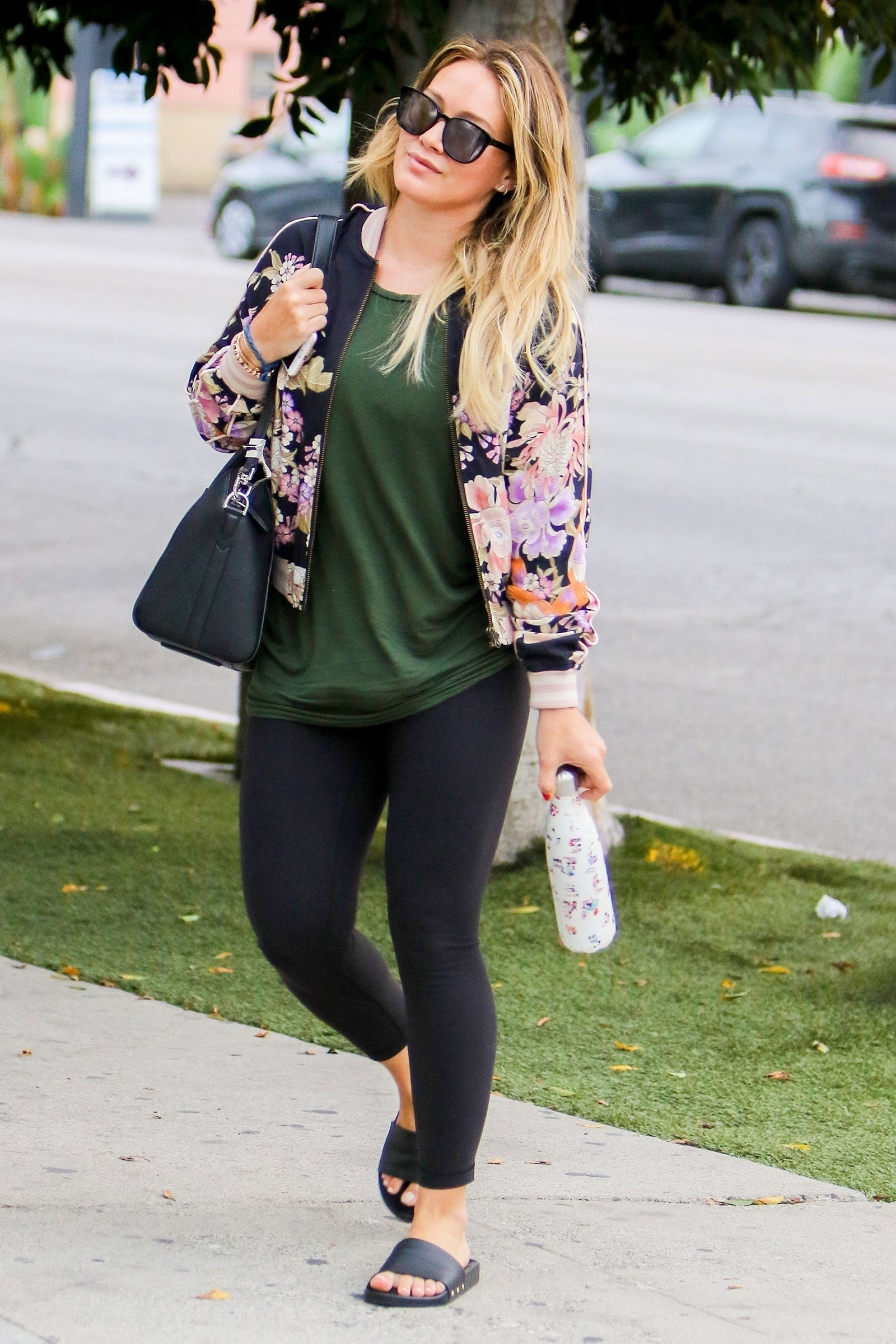 Hilary Duff heads to yoga class before an early dinner at Fig & Olive in West Hollywood with a friend.