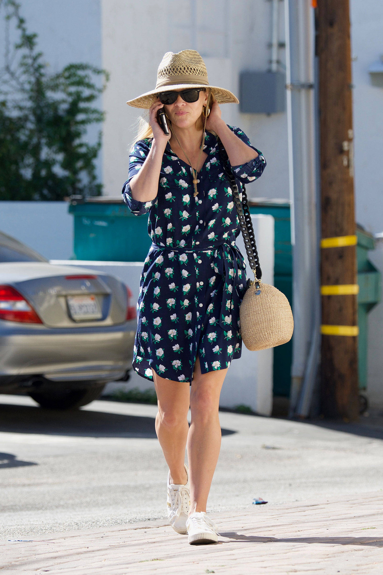 Steal Her Style: Reese Witherspoon's floral dress and white sneakers outfit for summer