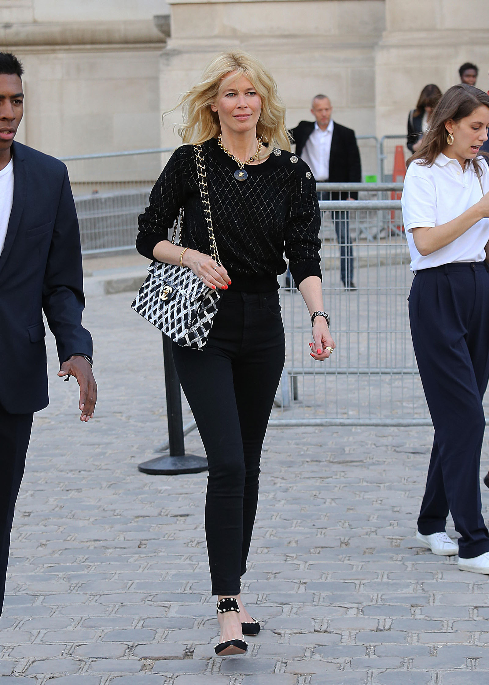 Claudia Schiffer stuns in Chanel accessories and all black outfit!