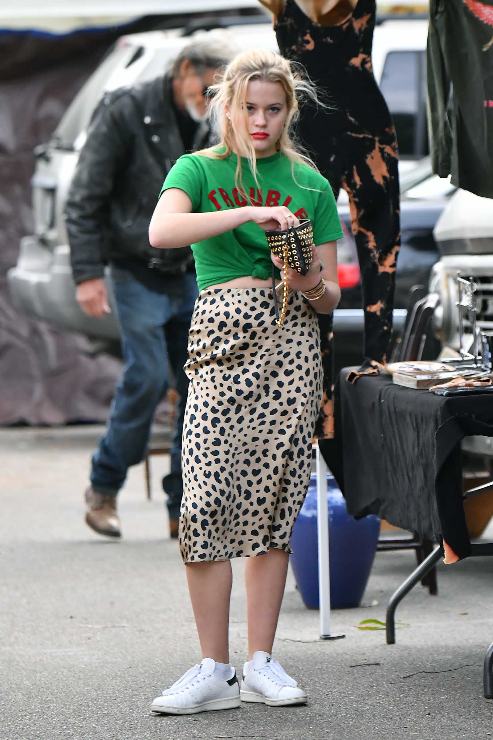 Ava Phillippe switches up casual with a satin leopard midi.