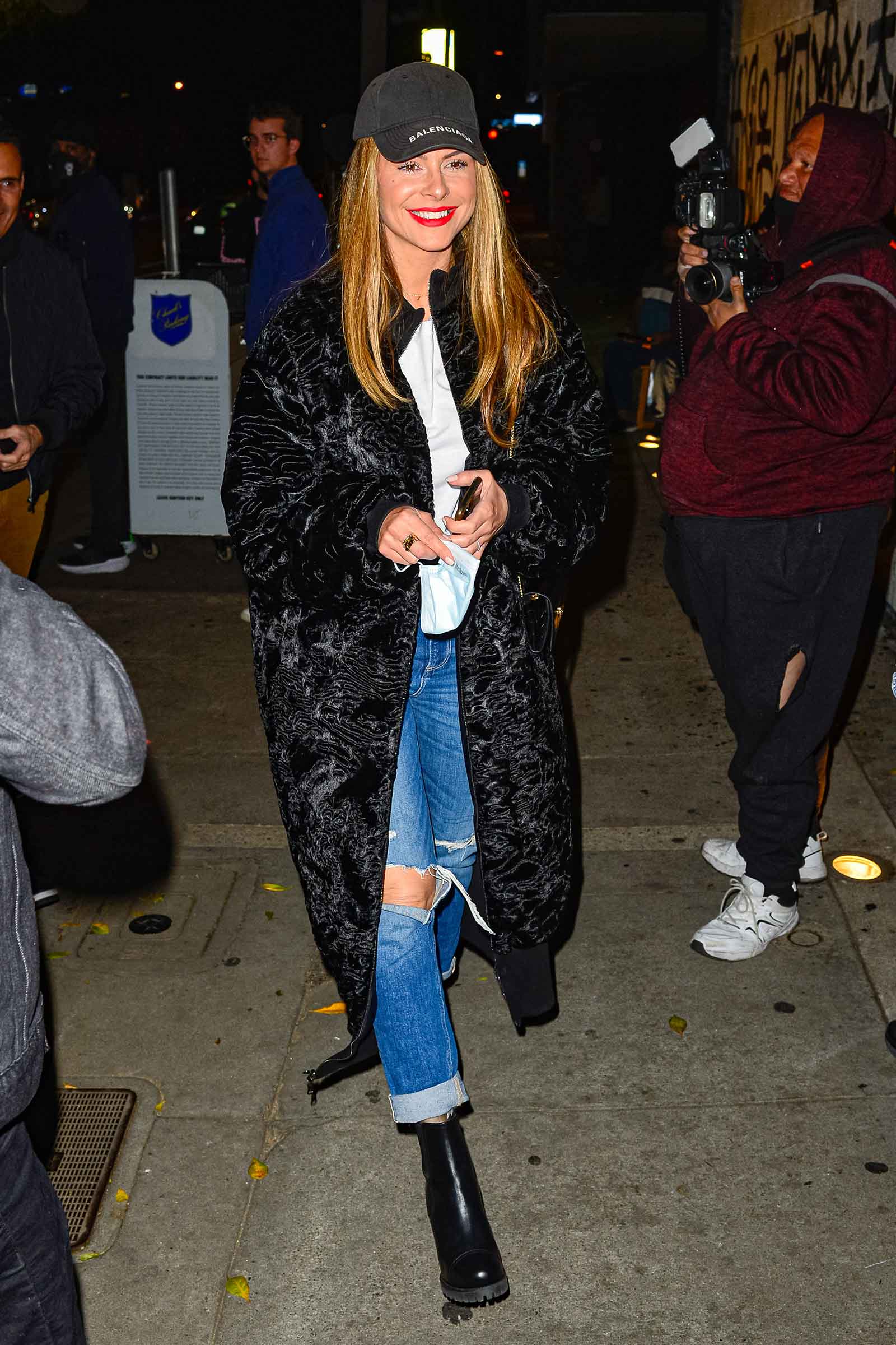 Maria Menounos is edgy and on-trend in a faux fur coat with lug sole boots