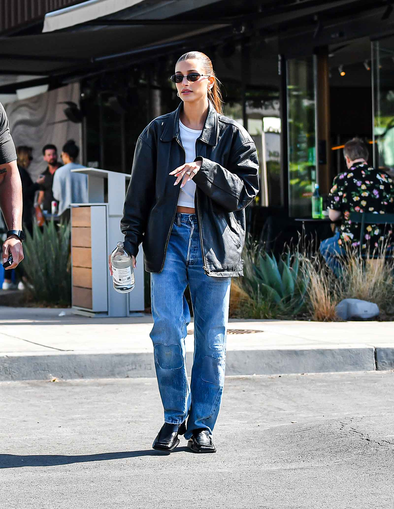 Hailey Beiber's oversized leather jacket and baggy jeans look for less