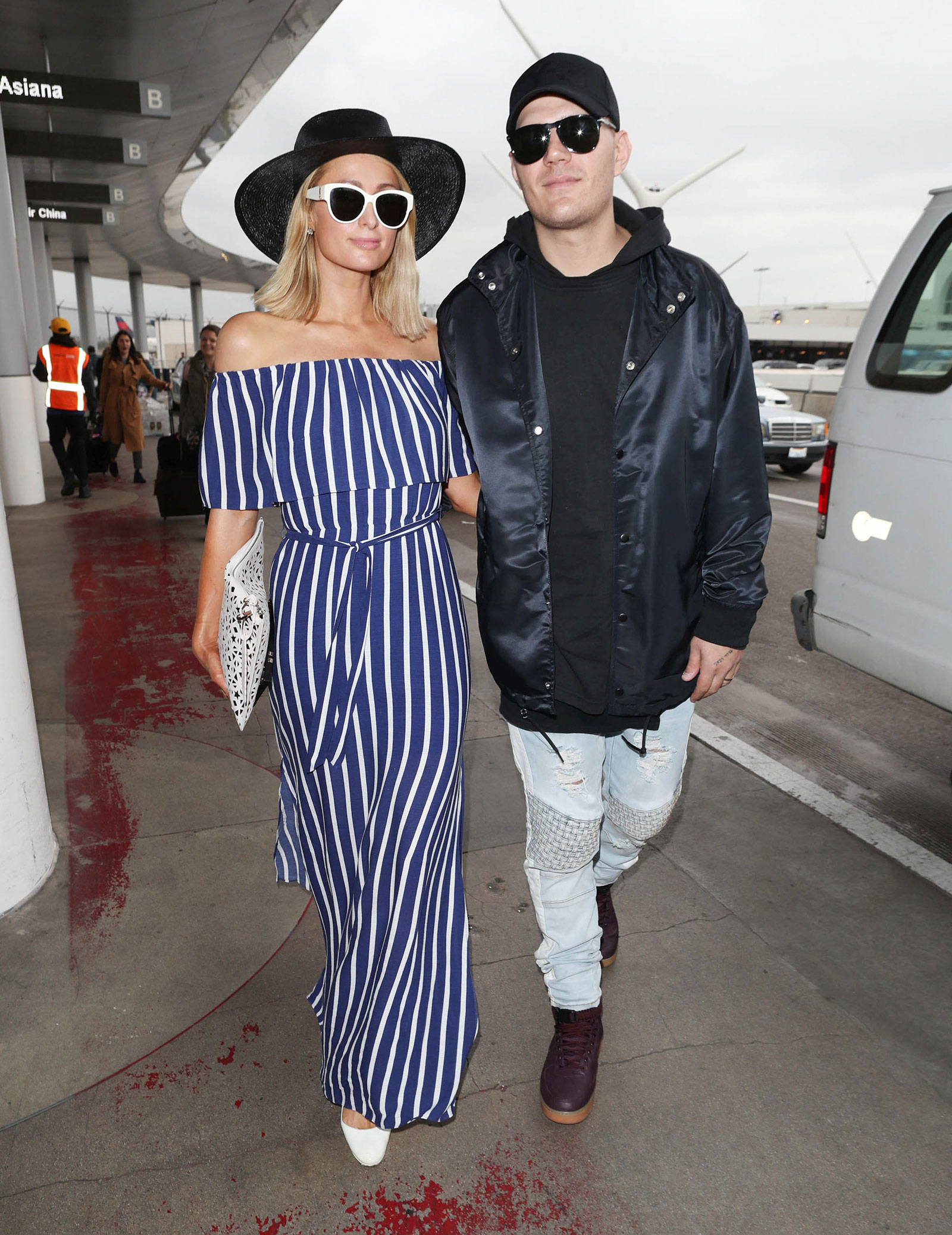 Paris Hilton Striped Jumpsuit and White Accessories Paris Hilton Striped Jumpsuit and White Accessories